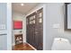 Inviting foyer featuring a beautiful wooden door and lovely hardwood floors at 918 Orient St, Durham, NC 27701