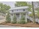 Two-story home features a covered front porch and well-manicured landscaping at 918 Orient St, Durham, NC 27701