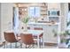 Eat in kitchen featuring stainless steel appliances, a kitchen island, and modern finishes perfect for cooking and entertaining at 918 Orient St, Durham, NC 27701