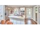 Bright kitchen with stainless steel appliances, a kitchen island, and open shelving provides a modern space at 918 Orient St, Durham, NC 27701