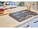 Close-up of a kitchen island with a built-in gas cooktop, offering a sleek and modern cooking experience at 918 Orient St, Durham, NC 27701