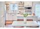 Bright kitchen with white cabinets, stainless appliances, and marble countertops provides a modern cooking space at 918 Orient St, Durham, NC 27701
