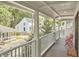 Inviting front porch with white railings, outdoor seating, and views of the neighborhood at 918 Orient St, Durham, NC 27701