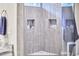 Modern shower design with built-in shelves and gray tiling at 918 Orient St, Durham, NC 27701