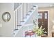 A staircase featuring white risers and dark wood treads at 918 Orient St, Durham, NC 27701