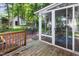 The spacious backyard features a well-maintained deck area and an enclosed sunroom for relaxing at 1002 Springmill Ct, Apex, NC 27502