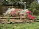 Gorgeous azaleas bursting with color in the landscaped backyard at 1002 Springmill Ct, Apex, NC 27502