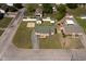 An aerial view showing the house and surrounding lot including a fire pit and shed at 101 Pine St, Dunn, NC 28334