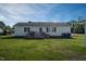 Backyard with a small deck at 101 Pine St, Dunn, NC 28334