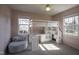 A bedroom with pink walls, a loft bed, a desk, and a cozy chair at 101 Pine St, Dunn, NC 28334