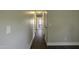 A long hallway with wood floors leading to bedrooms and living spaces at 101 Pine St, Dunn, NC 28334