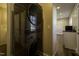 Convenient laundry area equipped with a sleek, stacked washer and dryer unit, adjacent to additional storage space at 101 Pine St, Dunn, NC 28334