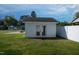 Well-maintained shed with double doors, set in a lush backyard at 101 Pine St, Dunn, NC 28334