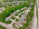 A neighborhood featuring mature trees and well-maintained lawns at 103 Woodland Ridge Ct, Cary, NC 27519
