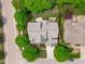 Overhead view of a well-maintained home featuring a landscaped yard and a neutral-colored roof at 103 Woodland Ridge Ct, Cary, NC 27519