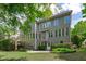 View of the backyard with a patio and well-maintained landscaping that enhances the property's appeal at 103 Woodland Ridge Ct, Cary, NC 27519