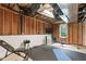 Unfinished basement area with gym equipment offers the perfect space for workouts and fitness activities at 103 Woodland Ridge Ct, Cary, NC 27519
