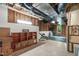 Unfinished basement featuring a workout area, shelving, and visible ceiling mechanics at 103 Woodland Ridge Ct, Cary, NC 27519