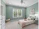 Bedroom featuring natural light, a ceiling fan, and stylish furnishings at 103 Woodland Ridge Ct, Cary, NC 27519