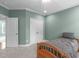 View of bedroom with closet and door to another room, featuring a comfortable twin bed at 103 Woodland Ridge Ct, Cary, NC 27519