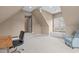 Bright bonus room with built-in storage, arched window and ample natural light, ideal for versatile use at 103 Woodland Ridge Ct, Cary, NC 27519
