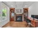 This office features a fireplace, custom cabinets and shelves, hardwood floors and a large window at 103 Woodland Ridge Ct, Cary, NC 27519