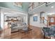 Open-concept living room with views of the kitchen, dining room, second story, fireplace, and hardwood floors at 103 Woodland Ridge Ct, Cary, NC 27519