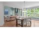 Open floor plan showcases a living room, dining area, and multiple windows at 103 Woodland Ridge Ct, Cary, NC 27519