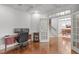 This office with hardwood floors features an adjacent dining room and staircase to the upper level at 103 Woodland Ridge Ct, Cary, NC 27519