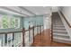 Upstairs hallway showing the staircase to downstairs and upstairs with beautiful railings at 103 Woodland Ridge Ct, Cary, NC 27519