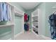 Custom walk-in closet with built-in shelving and ample hanging space for organized storage at 103 Woodland Ridge Ct, Cary, NC 27519