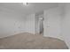 Cozy bedroom with neutral carpet, closet, and a door leading to other rooms at 1047 Aberlour Ln, Burlington, NC 27215