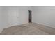 Bedroom with carpeted floors, neutral walls, and a doorway to another room in the home at 1047 Aberlour Ln, Burlington, NC 27215