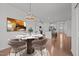 Dining room showcases a round table with seating, stylish decor, and an open view of the modern kitchen at 1047 Aberlour Ln, Burlington, NC 27215