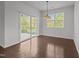 Bright dining room with hardwood floors, sliding glass doors, and natural lighting at 1047 Aberlour Ln, Burlington, NC 27215