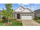 Charming home with a stone facade, white siding, and well-maintained landscaping at 1047 Aberlour Ln, Burlington, NC 27215