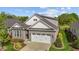 Charming house with a gray stone facade, gray siding and well-manicured landscaping at 1047 Aberlour Ln, Burlington, NC 27215