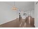Spacious living room with hardwood floors, an open concept design, and access to the kitchen at 1047 Aberlour Ln, Burlington, NC 27215