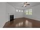 Bright living room features hardwood floors, a fireplace, and ample natural light at 1047 Aberlour Ln, Burlington, NC 27215