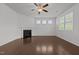 Bright living room features hardwood floors, a fireplace, and ample natural light at 1047 Aberlour Ln, Burlington, NC 27215