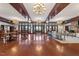 Grand lobby featuring high ceilings, wood accents, elegant chandeliers, and a spacious seating area at 1047 Aberlour Ln, Burlington, NC 27215