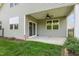 This covered patio has a ceiling fan and sliding door for indoor-outdoor flow at 1047 Aberlour Ln, Burlington, NC 27215