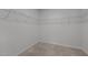 A walk-in closet with carpeted flooring and metal shelving for optimal storage at 1047 Aberlour Ln, Burlington, NC 27215