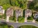 Aerial view of homes with lush landscaping, private yards, and well-maintained roofs at 107 Weslyn Trace Dr, Durham, NC 27703