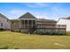 Exterior view of a screened-in porch with an adjacent wooden deck at 107 Weslyn Trace Dr, Durham, NC 27703
