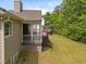 Spacious backyard featuring a screened porch and deck with stairs at 107 Weslyn Trace Dr, Durham, NC 27703