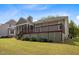 Spacious backyard featuring a screened porch and a multi-level deck at 107 Weslyn Trace Dr, Durham, NC 27703