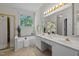 Bright bathroom with double sink vanity, soaking tub, and separate shower at 107 Weslyn Trace Dr, Durham, NC 27703