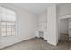 Bright bedroom featuring a built-in desk area and neutral color scheme at 107 Weslyn Trace Dr, Durham, NC 27703