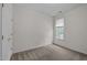 Bedroom with neutral carpet, white walls, and a double door closet at 107 Weslyn Trace Dr, Durham, NC 27703